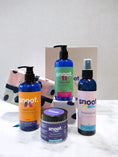 Load image into Gallery viewer, Gift set for pets, dogs and cats featuring a pet shampoo, pet conditioner, fragrance mist, and paw and nose butter
